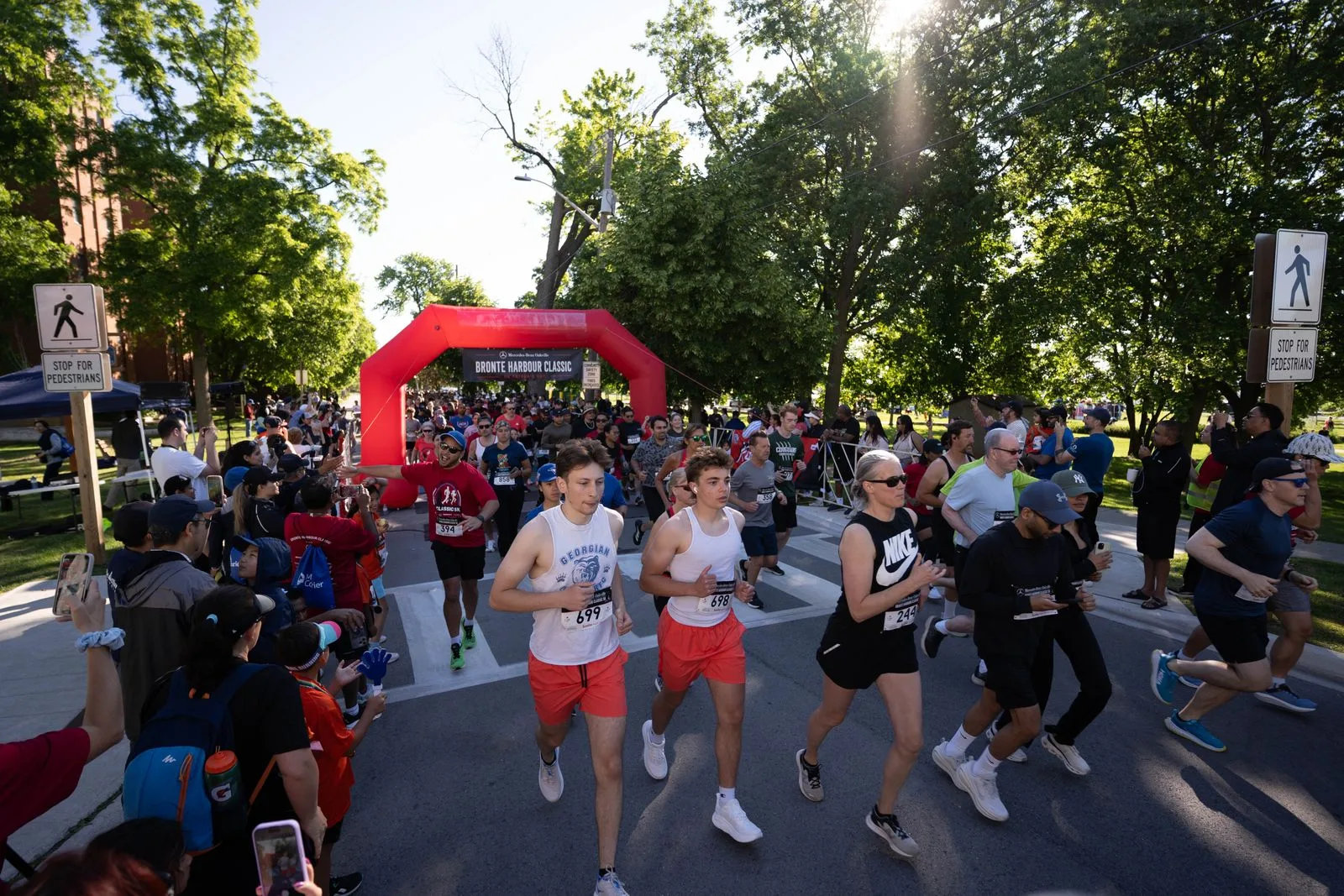 The crowd of finishers under the Bronte Harbour Classic arch, June 2026