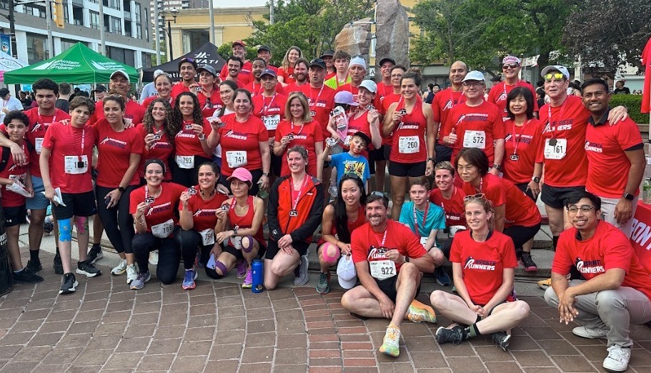 Bronte Runners members in red club shirts after a race